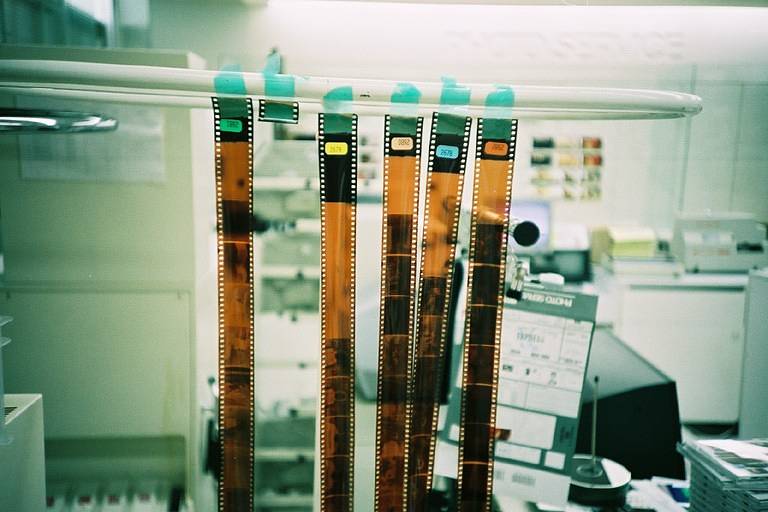 Reels of film being processed in a lab